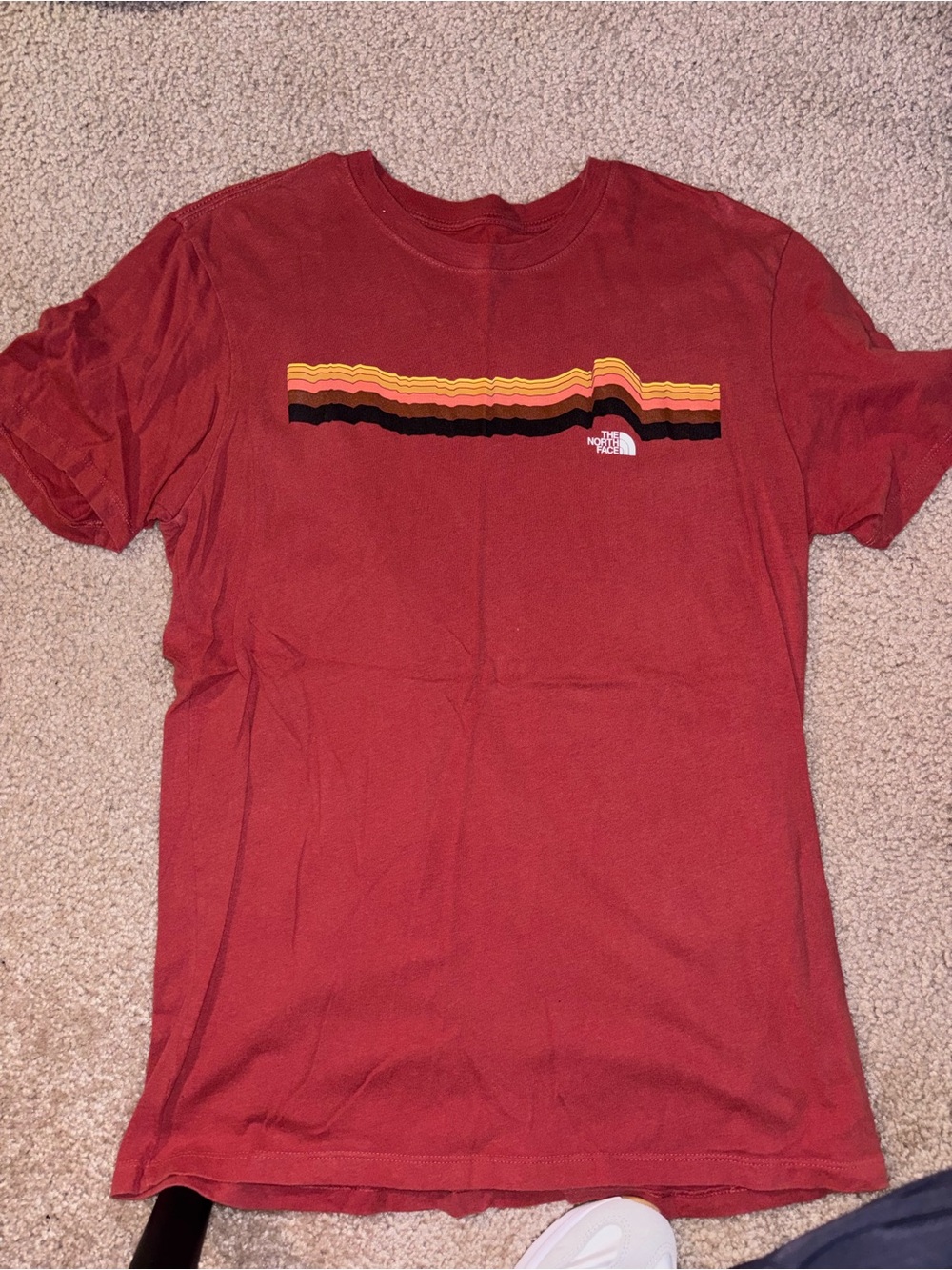 The North Face Men’s Rust Red Short-Sleeve Tee with Striped Chest Graphic